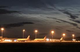 Planes on the runway at Inverness Airport at night